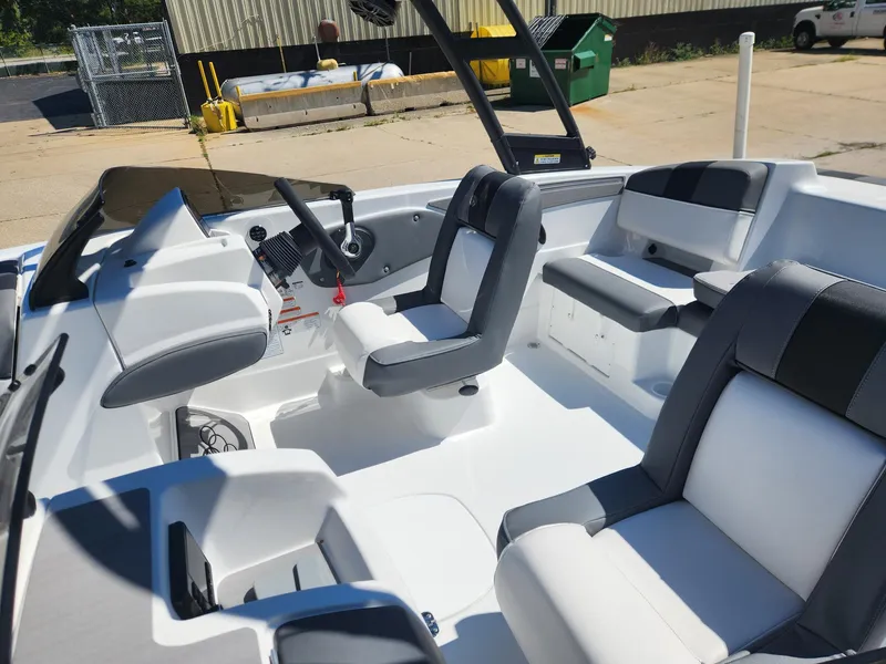 Slide: The Image of 2024 Tahoe T21 boat interior with modern seating and steering console. - 24