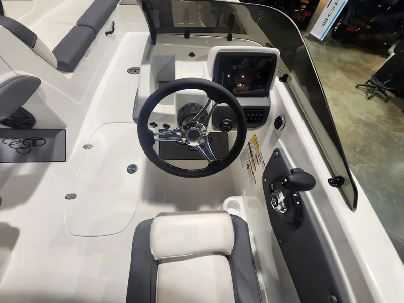 Slide: The Image of 2024 Tahoe T21 boat cockpit with steering wheel and control panel. - 9
