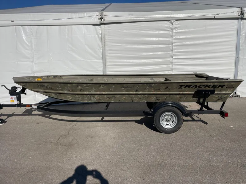 The Image of 2024 Tracker Grizzly 1754 Jon boat on a trailer, parked outdoors. - 0
