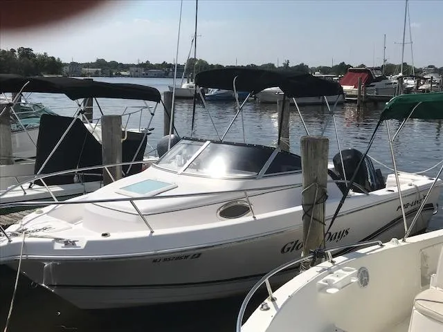 Slide: The Image of 2007 Pro-Line 21 Walk-Around boat docked at a marina. - 2