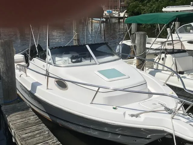 Slide: The Image of 2007 Pro-Line 21 WALK-AROUND boat docked at a marina. - 3