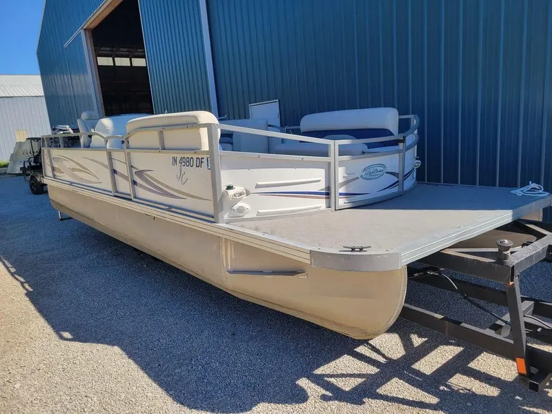 Slide: The Image of 2008 Custom Neptune 23 pontoon boat on trailer near blue warehouse. - 9