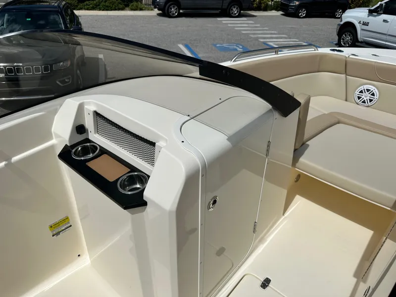 Slide: The Image of 2024 Scout 215 Dorado boat interior with cup holders and seating. - 10