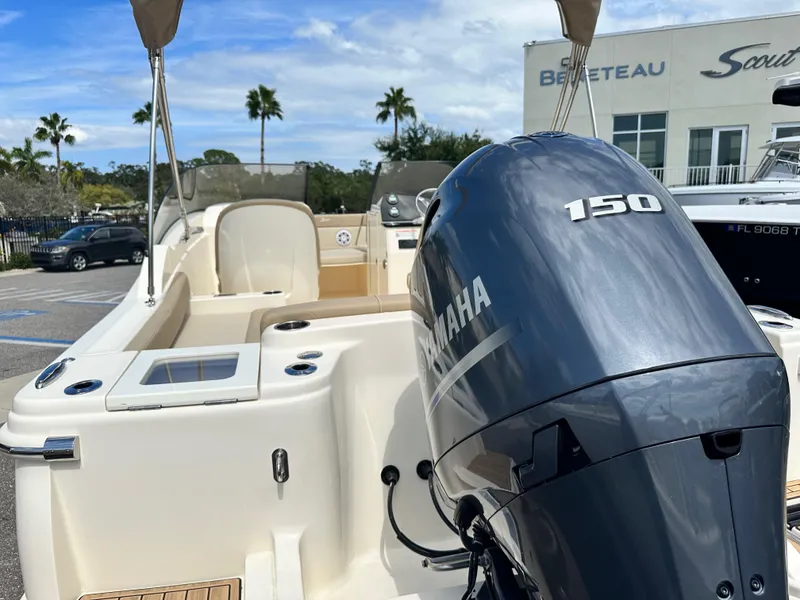 Slide: The Image of 2024 Scout 215 Dorado boat with Yamaha 150 engine at dealership. - 3
