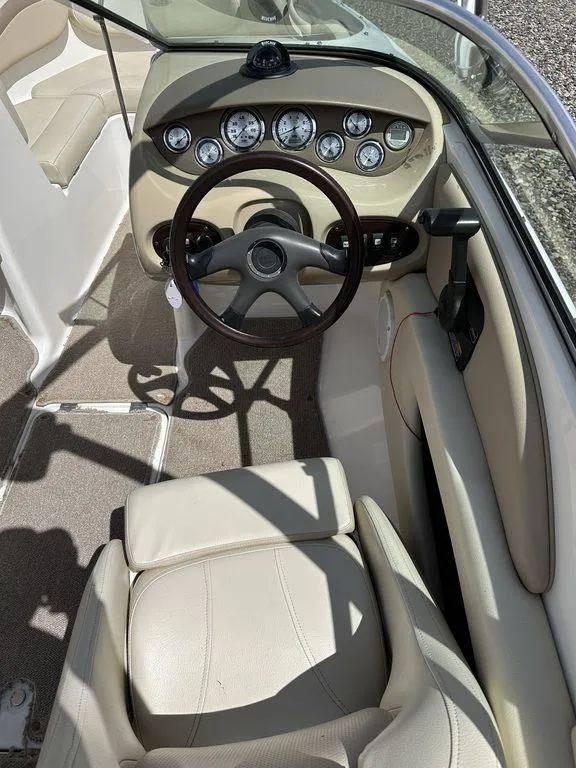 Slide: The Image of 2004 Chaparral 190SSI boat interior with steering wheel and dashboard gauges. - 10