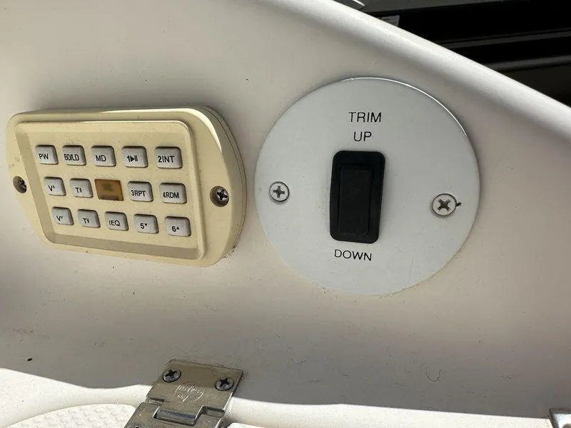 Slide: The Image of 2004 Chaparral 190SSI boat control panel with trim switch and keypad. - 4