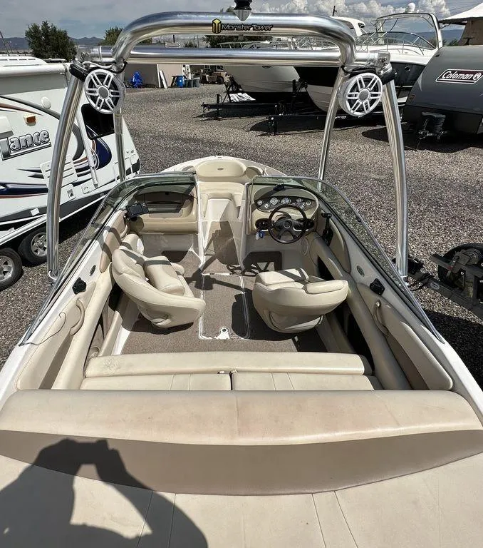 Slide: The Image of 2004 Chaparral 190SSI boat interior with seating and steering wheel. - 7