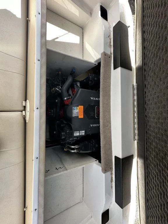 Slide: The Image of 2004 Chaparral 190SSI boat engine compartment with visible engine components. - 8