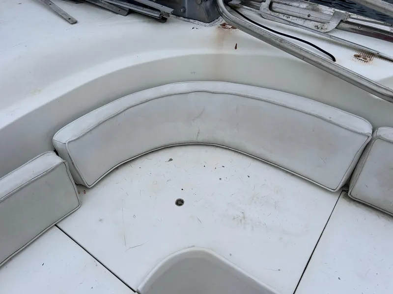 Slide: The Image of 1989 MedYacht Morocco boat interior with white cushioned seating. - 13