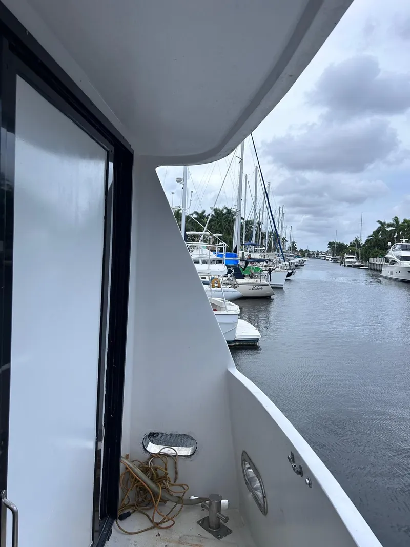 Slide: The Image of Side view of 1989 MedYacht Morocco docked at a marina. - 2