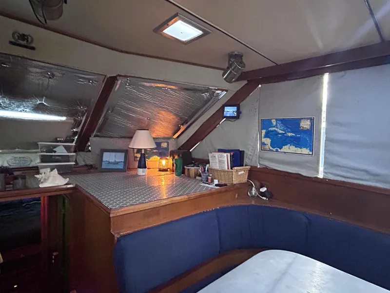 Slide: The Image of Interior of 1989 MedYacht Morocco with cozy seating and navigation area. - 26