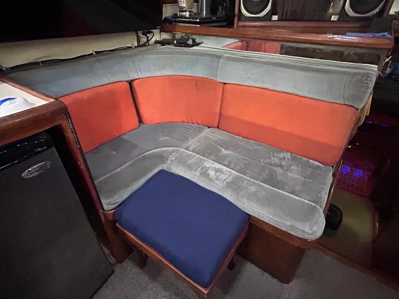 Slide: The Image of 1989 MedYacht Morocco interior with cushioned seating and small fridge. - 30