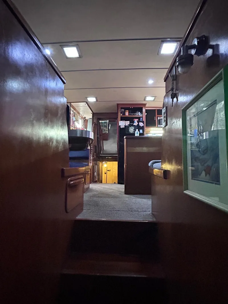 Slide: The Image of Interior of 1989 MedYacht Morocco, featuring wooden cabinetry and cozy lighting. - 44