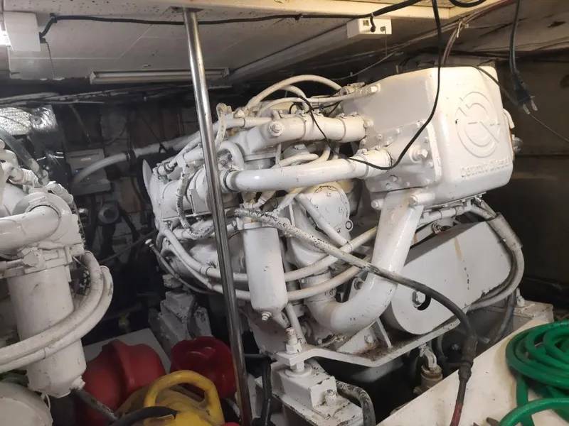 Slide: The Image of Engine room of a 1989 MedYacht Morocco with visible machinery and hoses. - 5