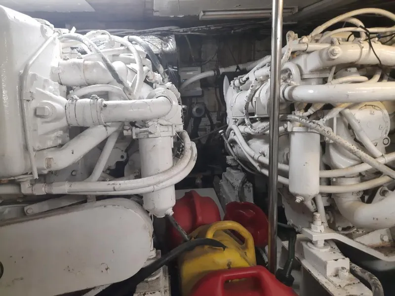 Slide: The Image of Engine room of a 1989 MedYacht Morocco with dual engines and fuel containers. - 6