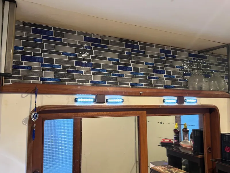 Slide: The Image of Custom glass tiles above vanity aft head - 62