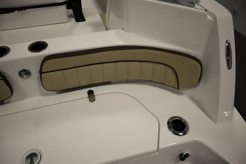 Slide: The Image of 2024 Yamaha Boats 222 FSH Sport interior seating detail with beige upholstery. - 10