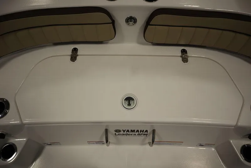 Slide: The Image of 2024 Yamaha Boats 222 FSH Sport interior seating and storage area. - 26