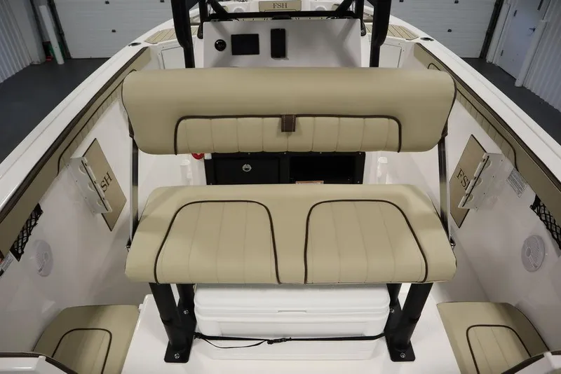 Slide: The Image of 2024 Yamaha Boats 222 FSH Sport interior with beige seating and modern design. - 32
