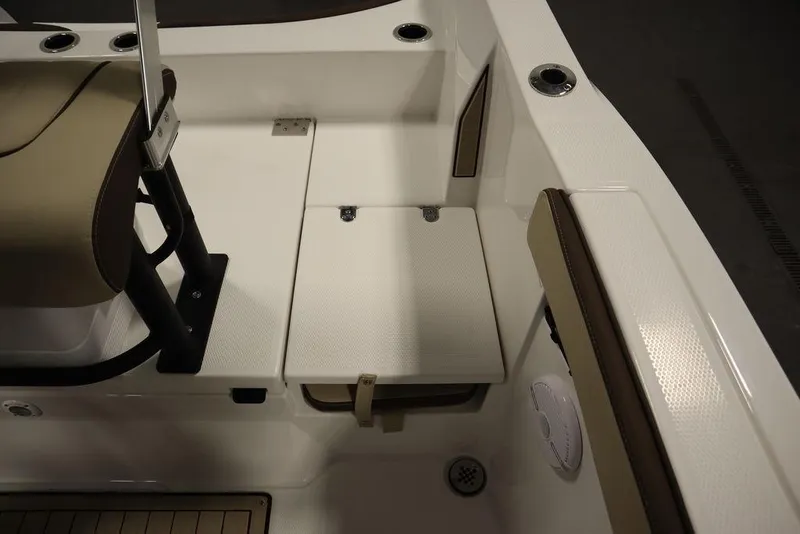 Slide: The Image of 2024 Yamaha Boats 222 FSH Sport interior seating and storage area. - 37