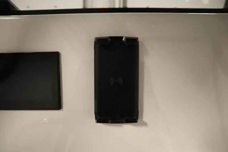 Slide: The Image of 2024 Yamaha Boats 222 FSH Sport dashboard with wireless charging pad. - 47