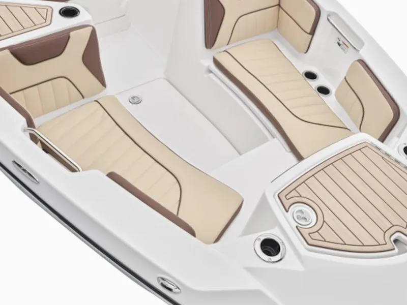 Slide: The Image of 2024 Yamaha Boats 222 FSH Sport interior with beige and brown seating, sleek design. - 9