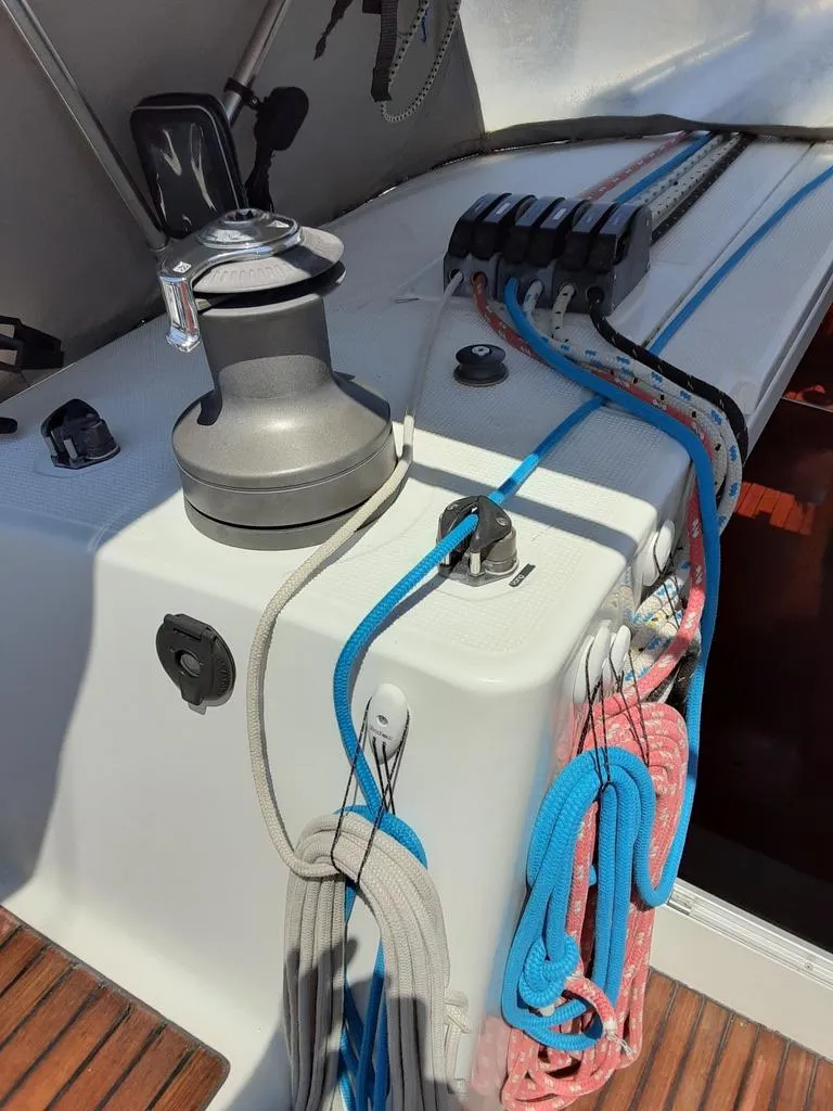 Slide: The Image of 2005 Beneteau First 44.7 sailboat deck with winch and colorful ropes. - 13