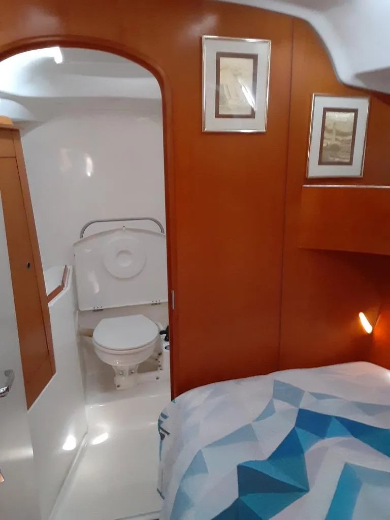 Slide: The Image of 2005 Beneteau First 44.7 yacht interior with cozy cabin and bathroom. - 15