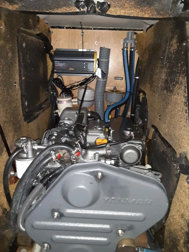 Slide: The Image of Engine compartment of a 2005 Beneteau First 44.7 sailboat, featuring a Yanmar engine. - 19