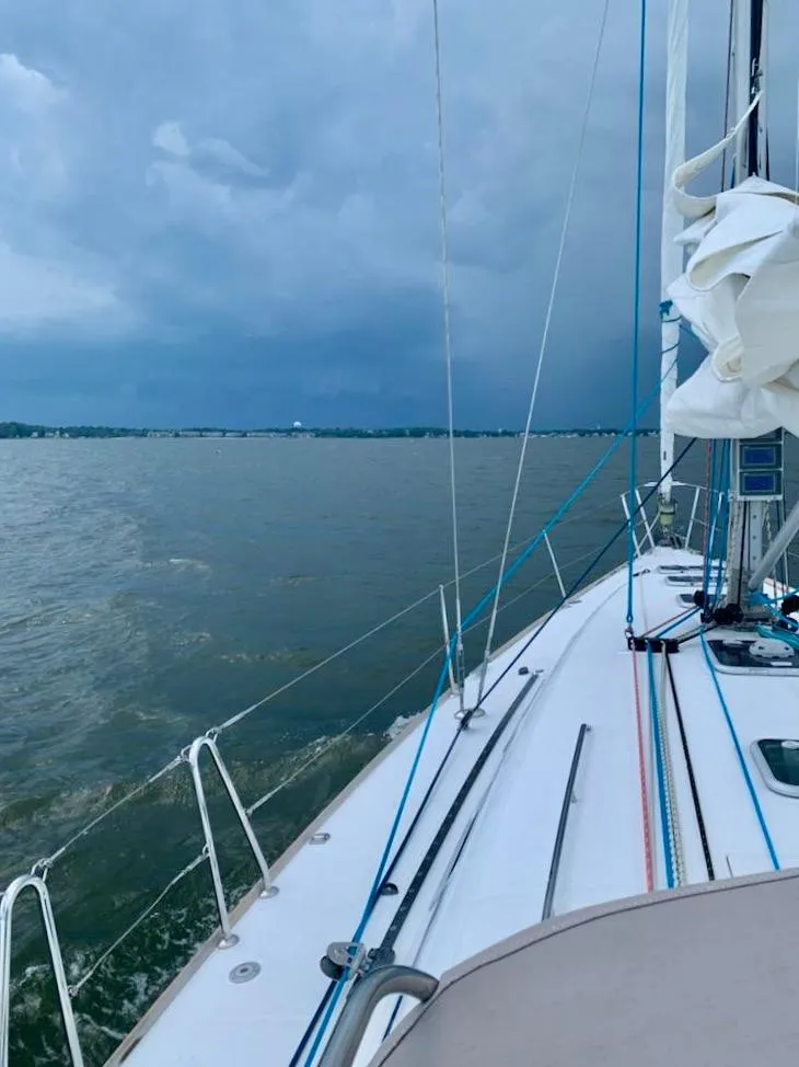 Slide: The Image of Sailing on a 2005 Beneteau First 44.7 yacht under cloudy skies. - 9