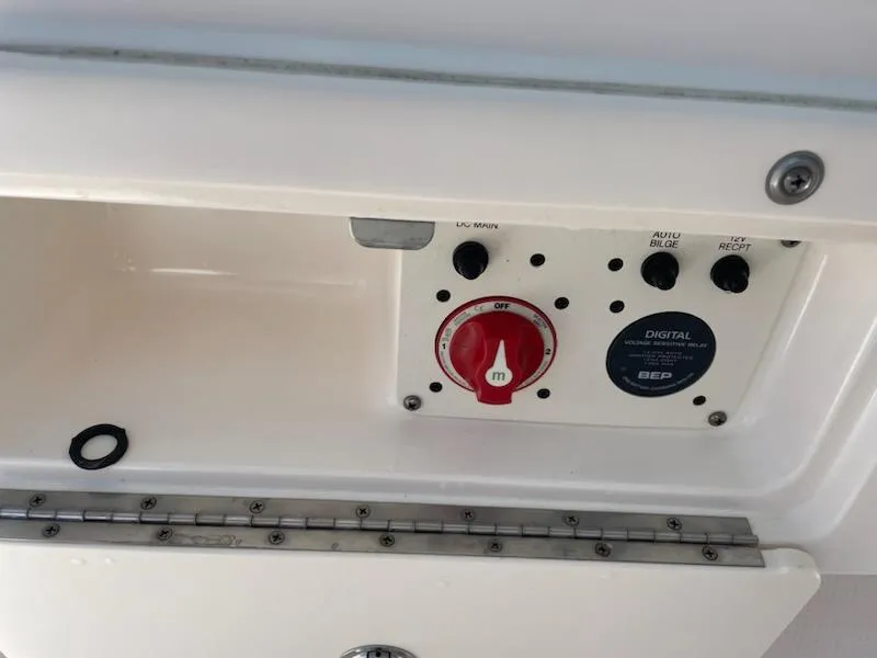 Slide: The Image of Control panel of a 2016 Robalo 246 Cayman boat with digital switch and red knob. - 18