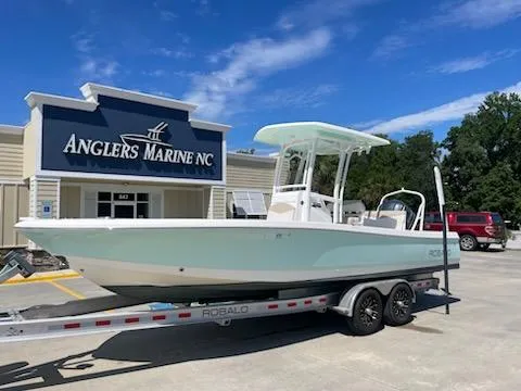 Slide: The Image of 2016 Robalo 246 Cayman boat on trailer at Anglers Marine NC dealership. - 1