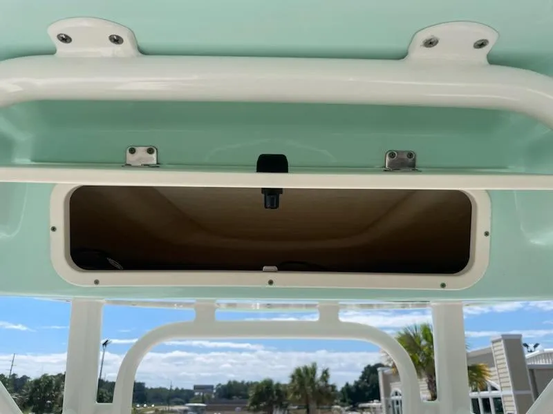 Slide: The Image of Storage compartment on a 2016 Robalo 246 Cayman boat. - 19