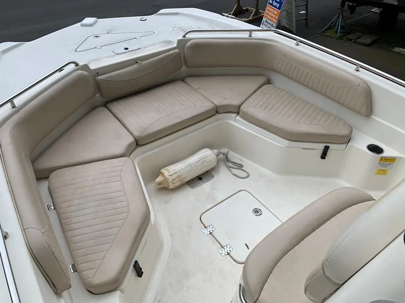Slide: The Image of 2013 NauticStar 210 Coastal boat with spacious seating and beige cushions. - 6