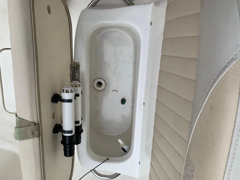 Slide: The Image of 2013 NauticStar 210 Coastal boat interior with storage compartment. - 7