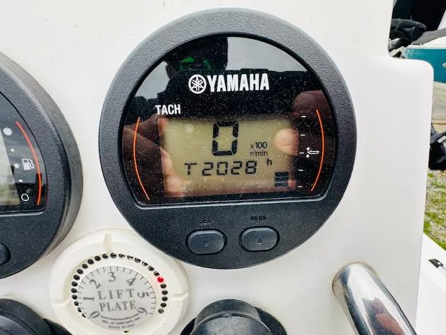 Slide: The Image of Yamaha tachometer on 2012 Sea Fox 22 XT boat, displaying 2028 hours. - 10