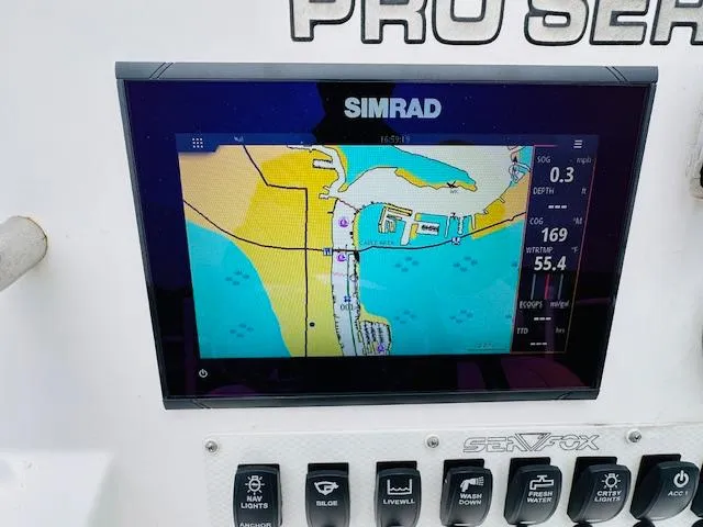 Slide: The Image of Simrad navigation display on 2012 Sea Fox 22 XT boat dashboard. - 11