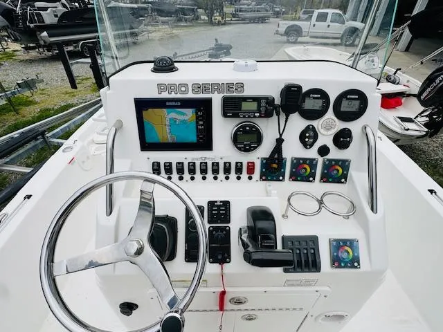 Slide: The Image of Control panel of a 2012 Sea Fox 22 XT boat with navigation equipment. - 12