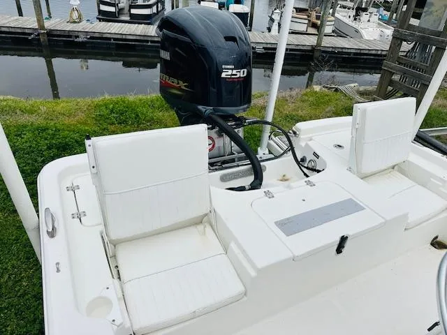 Slide: The Image of 2012 Sea Fox 22 XT boat with Yamaha 250 engine, docked near water. - 16