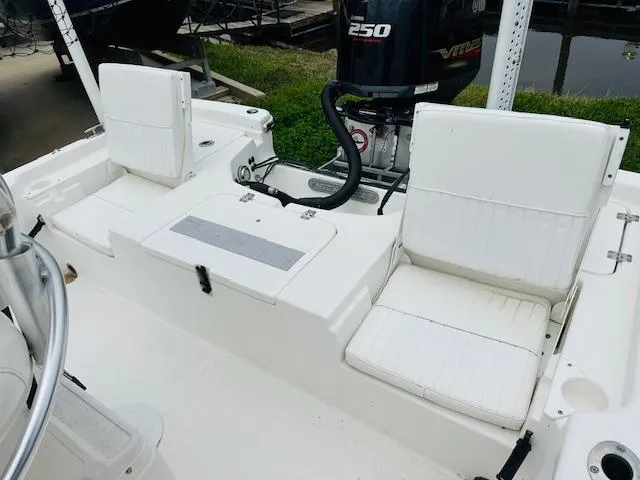 Slide: The Image of 2012 Sea Fox 22 XT boat interior with white seating and Yamaha 250 engine. - 17