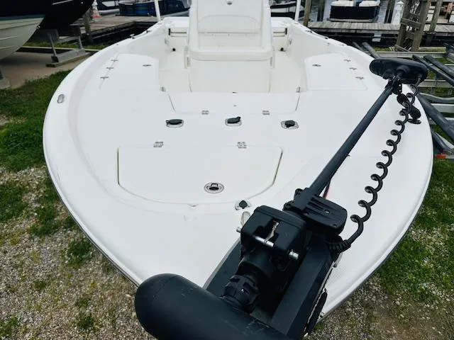Slide: The Image of 2012 Sea Fox 22 XT boat with trolling motor, docked on grassy area. - 5