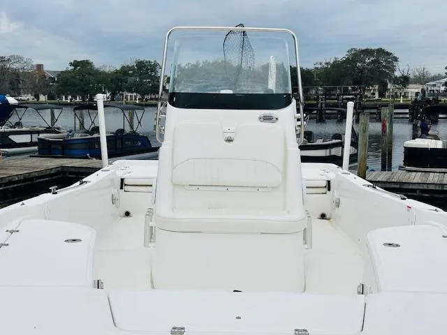 Slide: The Image of 2012 Sea Fox 22 XT boat at dock, featuring center console and spacious deck. - 6