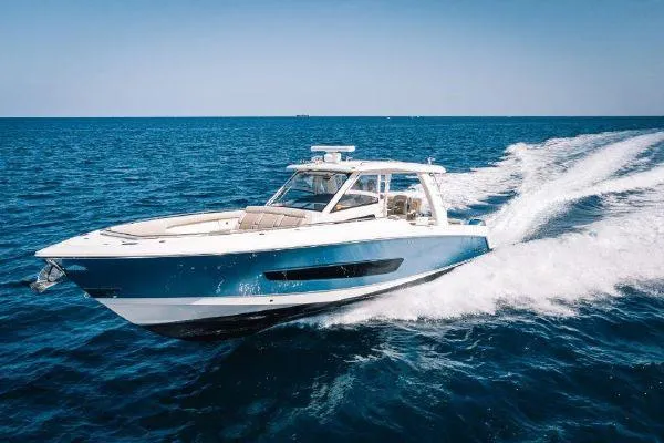 The Image of 2017 Boston Whaler 42 OUTRAGE cruising on open blue water. - 0