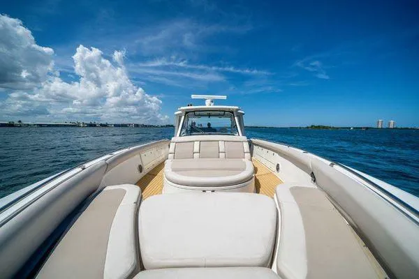 Slide: The Image of 2017 Boston Whaler 42 OUTRAGE boat on open water under blue sky. - 11