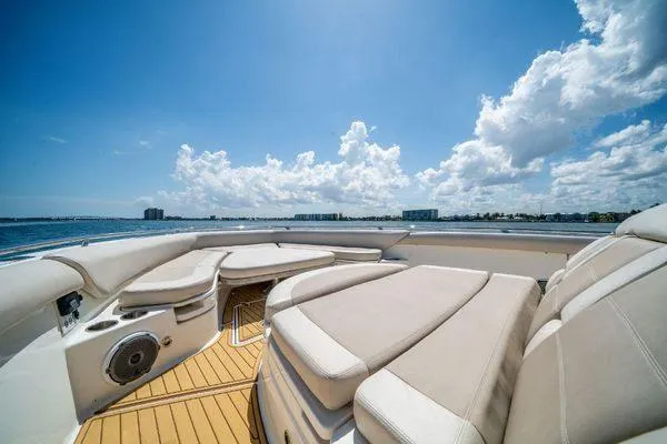Slide: The Image of Luxurious deck of 2017 Boston Whaler 42 OUTRAGE boat with cushioned seating. - 12