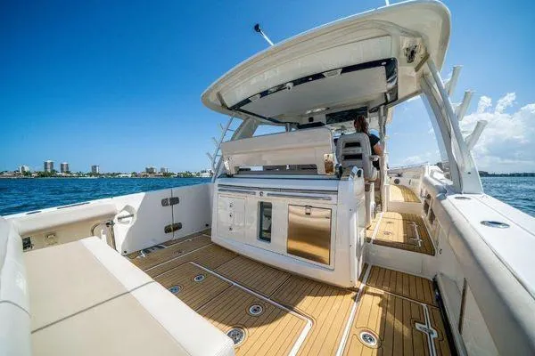 Slide: The Image of 2017 Boston Whaler 42 OUTRAGE boat interior with teak flooring and seating. - 13