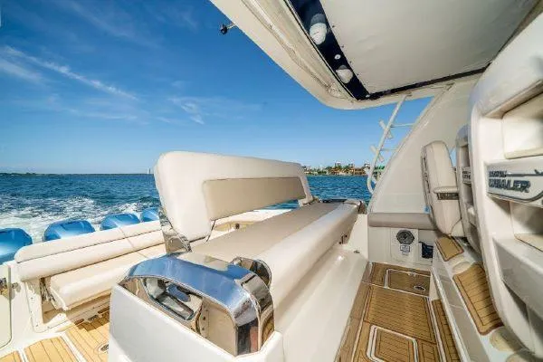 Slide: The Image of 2017 Boston Whaler 42 OUTRAGE boat interior with seating and ocean view. - 17
