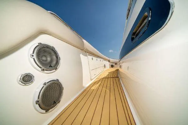 Slide: The Image of Side deck view of a 2017 Boston Whaler 42 OUTRAGE boat with teak flooring. - 20
