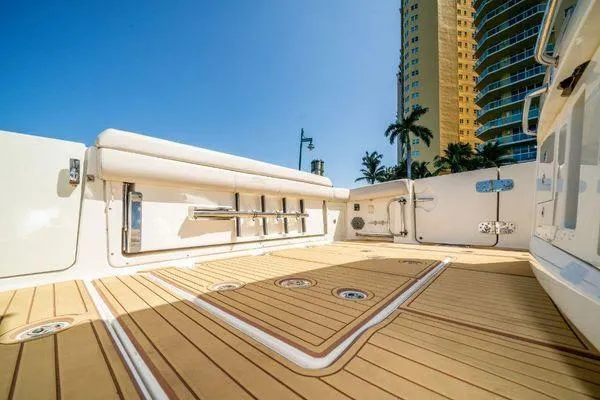 Slide: The Image of 2017 Boston Whaler 42 OUTRAGE boat deck with rod holders and teak flooring. - 25