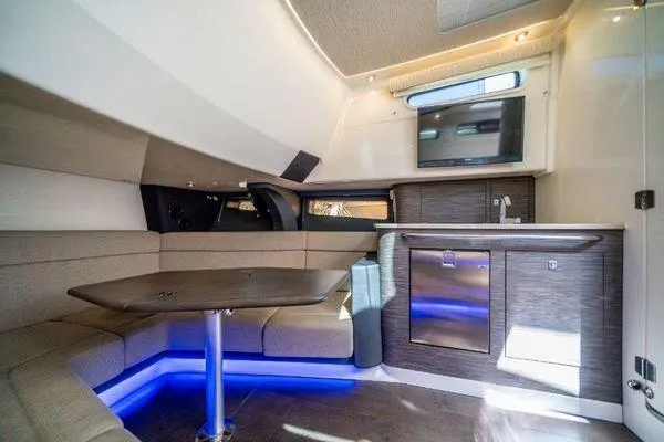 Slide: The Image of Interior of 2017 Boston Whaler 42 OUTRAGE with modern seating and kitchenette. - 28